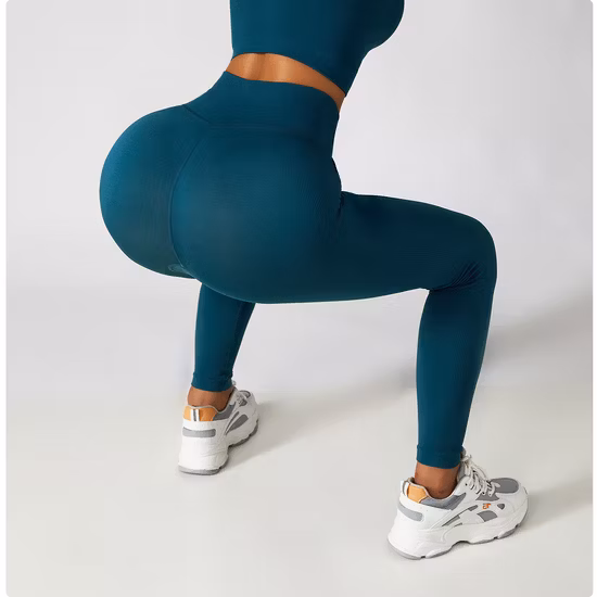 Fábrica de China 2023 Nuevas mujeres Entrenamiento de gimnasio Entrenamiento de levantamiento de cadera sin costuras Pantalones deportivos ajustados para correr Levantamiento de cadera Fitness Leggings de yoga atléticos